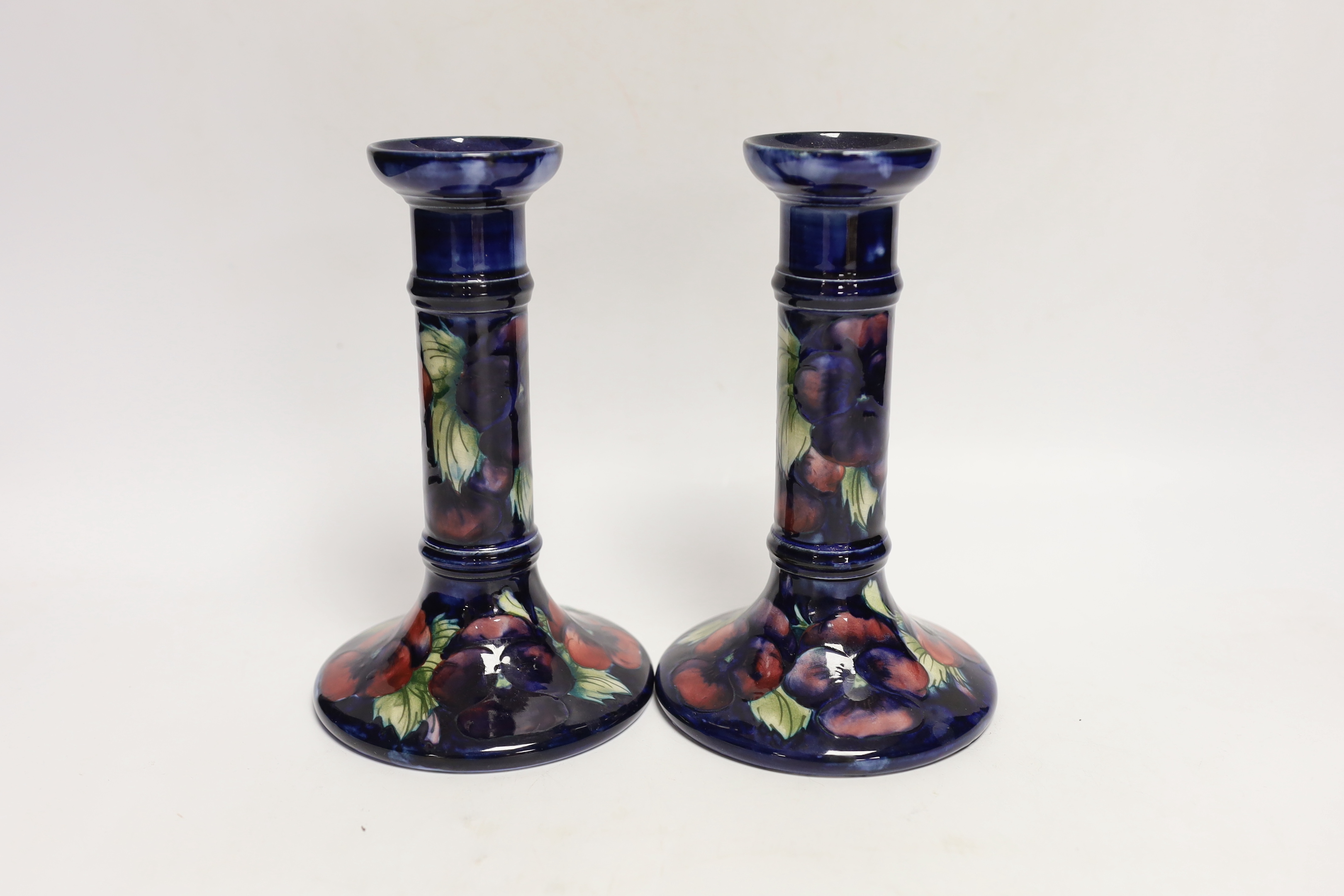 A pair of Moorcroft candlesticks, 18.5cm